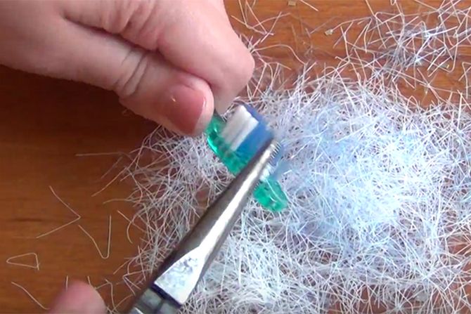 Use the pliers to remove the bristles.